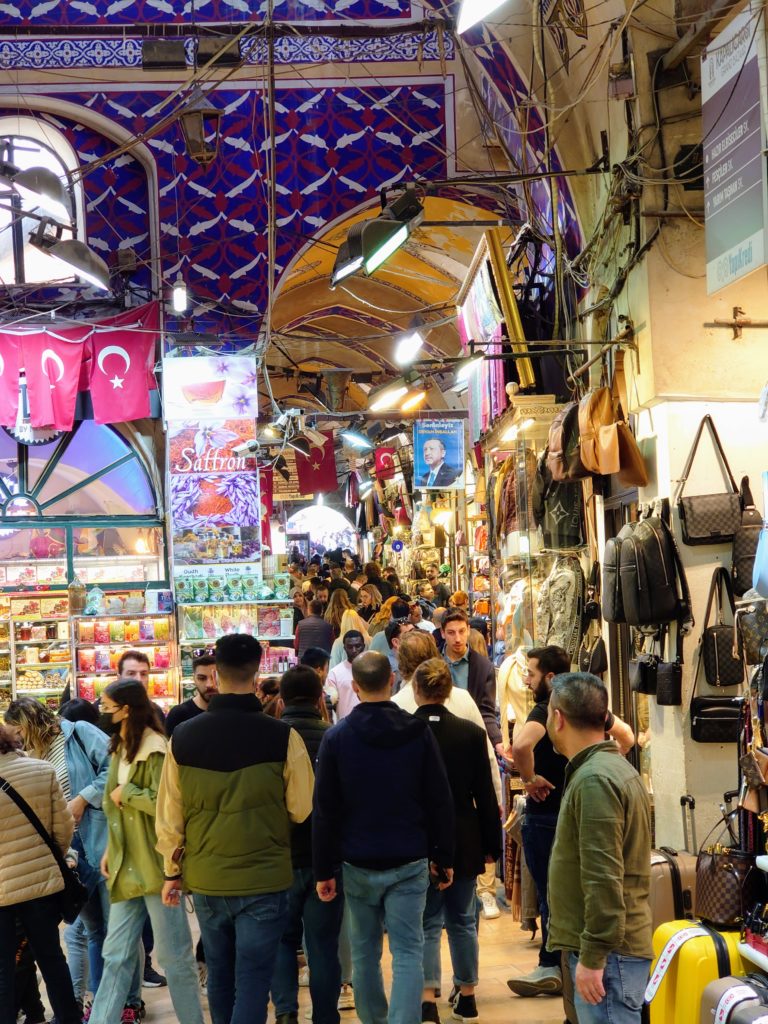 Grand Bazaar in Istanbul from the inside with people walking through