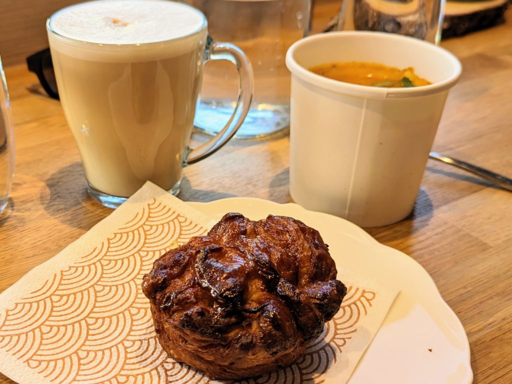 Kouign amann in Couette in Strasbourg alongside a coffee and a carrot-fennel soup